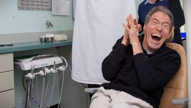 Adult patient smiling in dental chair